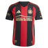 Adidas Atlanta United FC 2025 jersey with red and black vertical stripes and sponsor logos